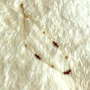 Gold necklace with simple beading detail